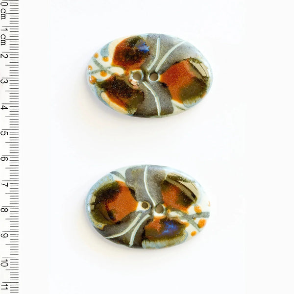 Incomparable Buttons - Large Oval Brown/Black L513 - Card of 2